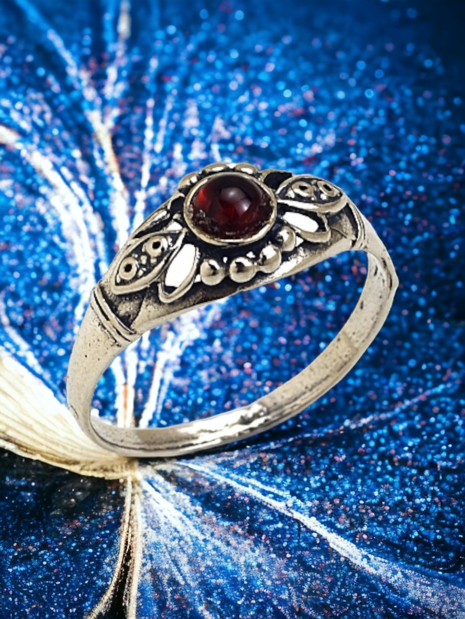 PURE SILVER RING SET WITH A GARNET STONE