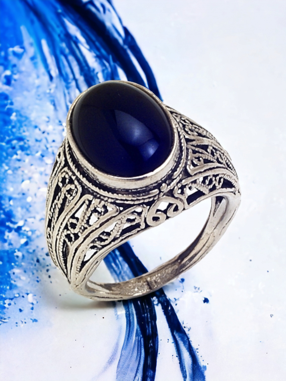 BAGUE EN ARGENT PUR SERTIE D'UNE PIERRE PRÉCIEUSE 